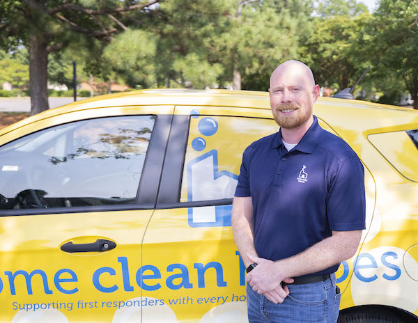 Home Clean Heroes of North Charlotte owner in front of van smiling