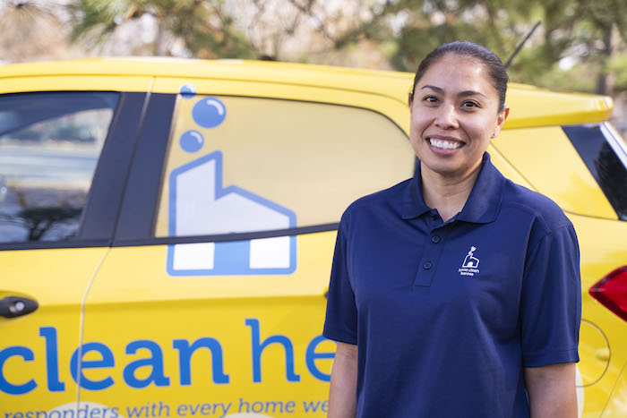 Home Clean Heroes of Northwest Houston owner standing in front of van smiling