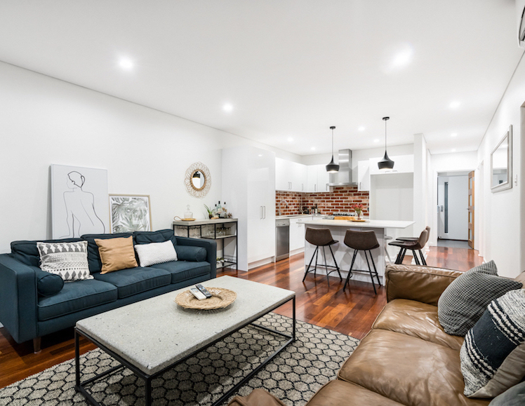 Living/dining room interior in modern Australian home with coffee table and modern industrial style decor