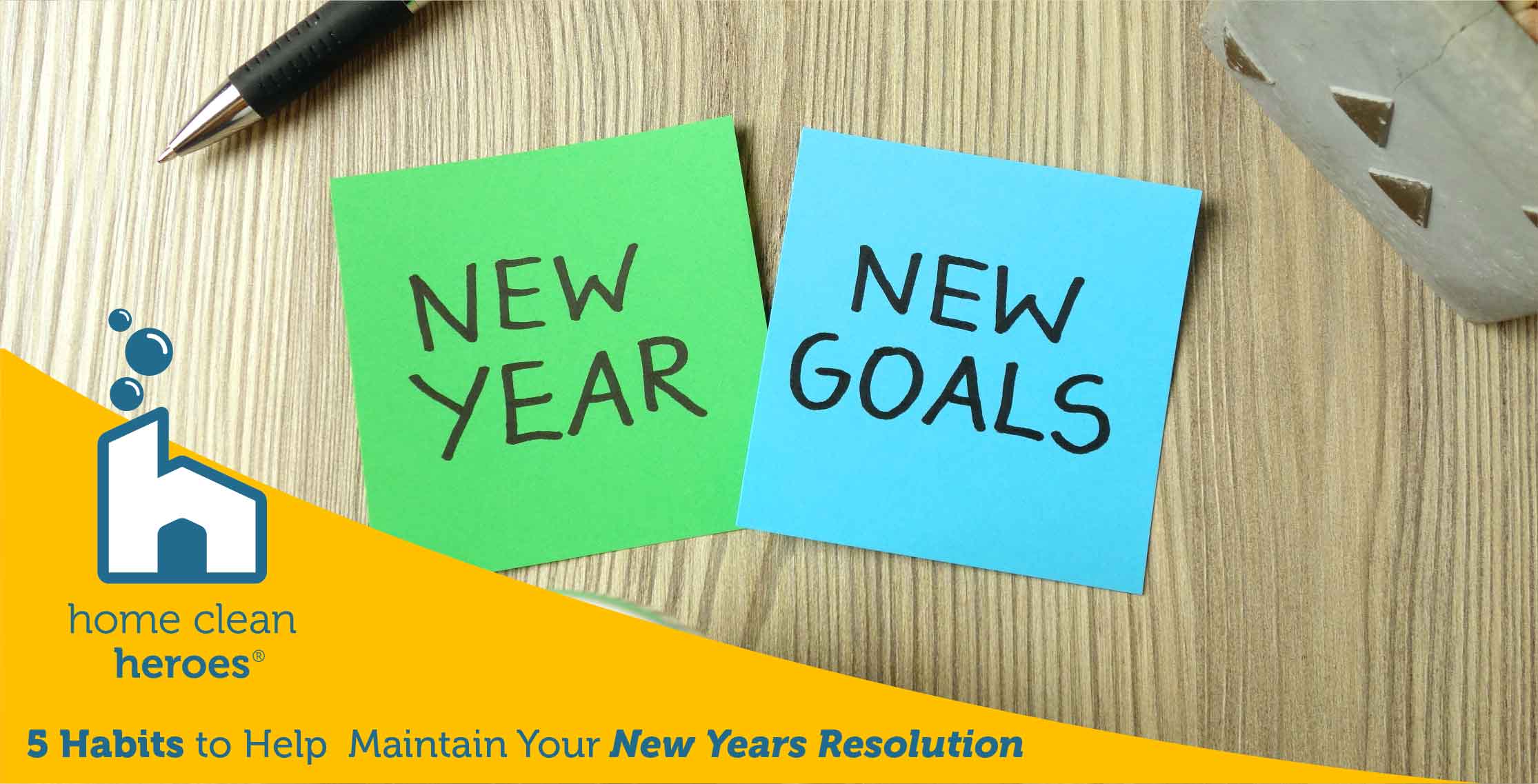 Post-It notes that say New Year New Goals on a desk
