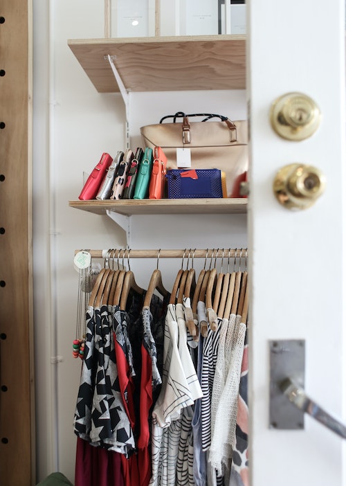 Organized closet with summer clothes
