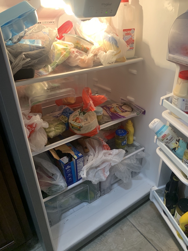 Messy fridge in need of a customized cleaning service by Home Clean Heroes