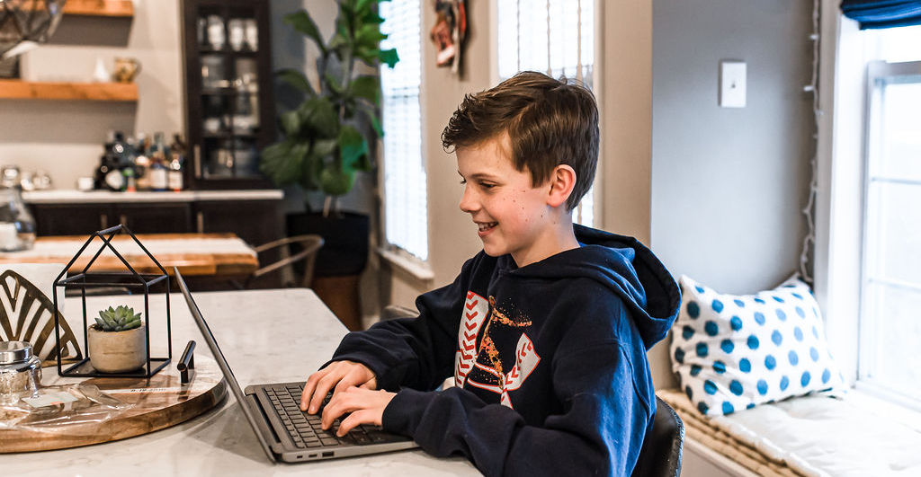 Student doing his homework in a clean home